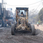 Heavy machinery being used during road construction work at Rajbah Road.