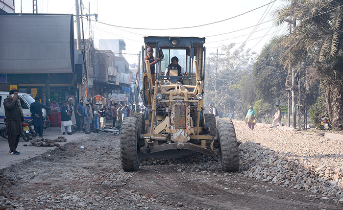 Heavy machinery being used during road construction work at Rajbah Road.