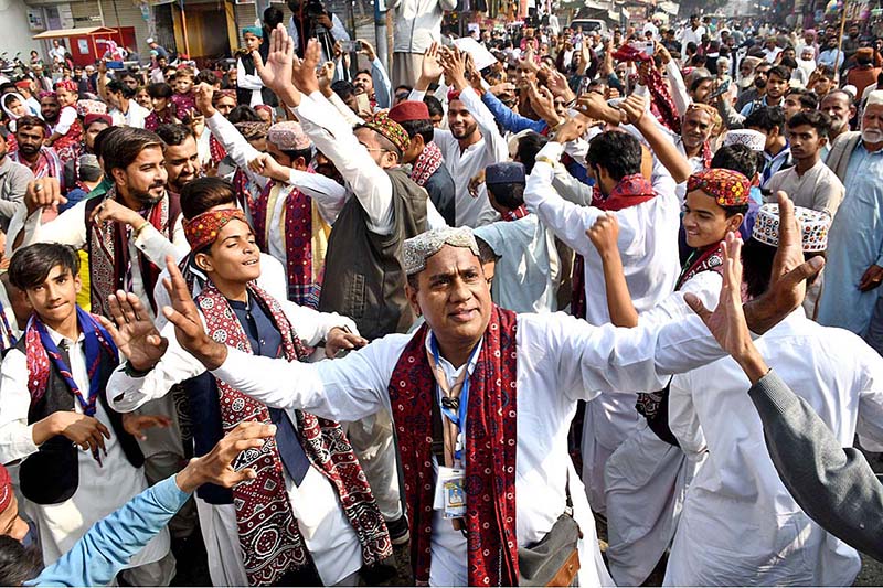 A Large number of people participating in a rally during the celebrations of Sindhi Ajrak Topi Culture Day at Jinnah Bagh Chowk