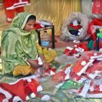 A woman vendor Displaying Christmas related stuff for Christian community at G-7 area in the Federal Capital