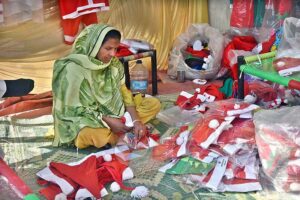 A woman vendor Displaying Christmas related stuff for Christian community at G-7 area in the Federal Capital