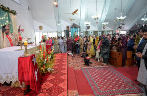 Christian community members performing religious rituals on Christmas day at Fatima Church. 