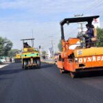 Labourers are busy in construction work of Lahore Road during development work in the city