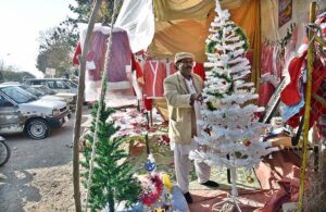 A woman vendor Displaying Christmas related stuff for Christian community at G-7 area in the Federal Capital