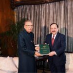 Senior Member Federal Public Service Commission, Mr. Akbar Hussain Durrani presenting Annual Report- 2022 of FPSC to President Dr Arif Alvi, at Aiwan-e-Sadr