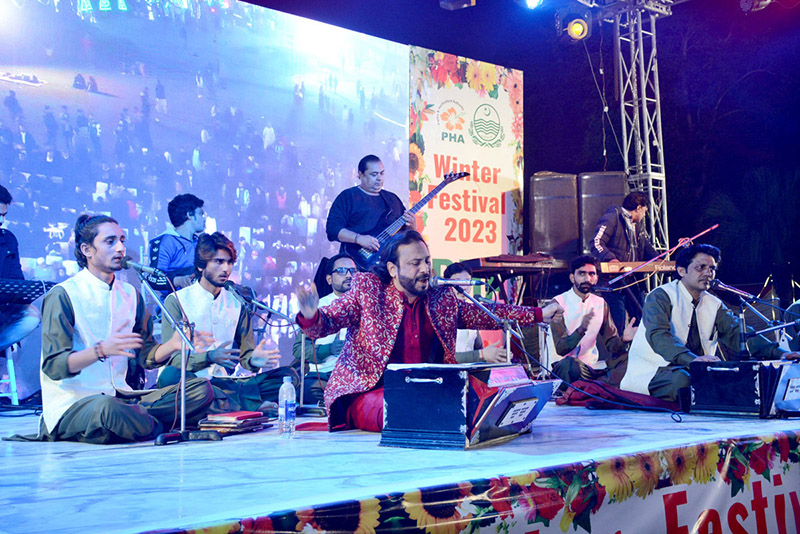 Divisional Commissioner Silwat Saeed is visiting stalls after inaugurating three days winter festival organized by the Parks and Horticultural Authority at Bagh-E-Jinnah Park on late Friday night