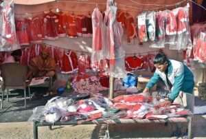 A woman vendor Displaying Christmas related stuff for Christian community at G-7 area in the Federal Capital