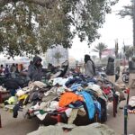 People purchasing used clothes at Landa Bazaar