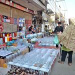 Vendor displaying Glass crockery and other items to attract customers at Chungi no.14