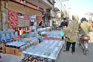 Vendor displaying Glass crockery and other items to attract customers at Chungi no.14