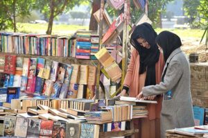 People busy in selecting and purchasing old books from roadside setup in Provincial Capital
