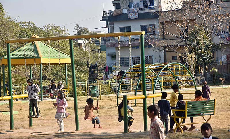 Children enjoy swings at a local Park at G 8 in the Federal Capital