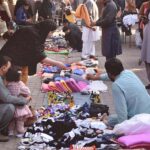 People purchasing household woolen stuff at G 9 weekly Bazaar in the Federal Capital.