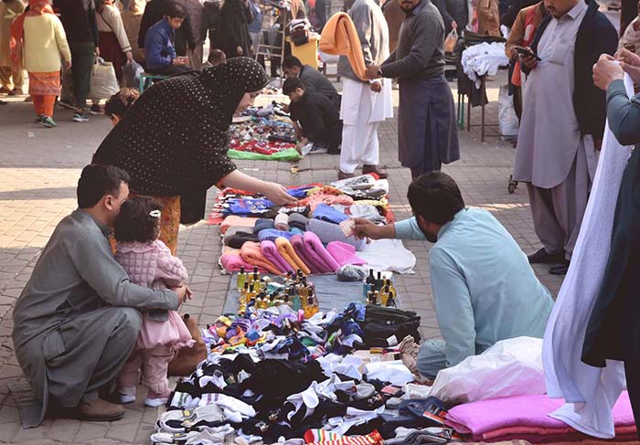 People purchasing household woolen stuff at G 9 weekly Bazaar in the Federal Capital.