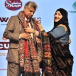 Caretaker Federal Minister for Information & Broadcasting Murtaza Solangi receiving a Sindhi Ajrak from the organizer during the Sindhi Cultural Day event organized by Soormiyun at PNCA