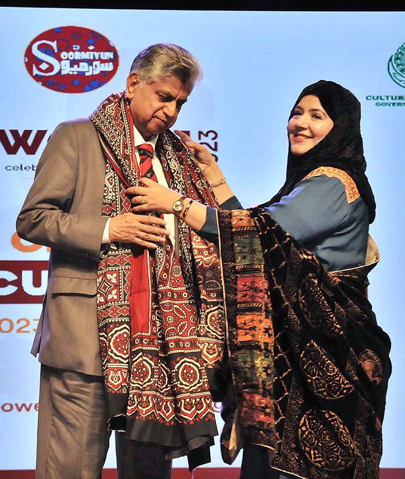 Caretaker Federal Minister for Information & Broadcasting Murtaza Solangi receiving a Sindhi Ajrak from the organizer during the Sindhi Cultural Day event organized by Soormiyun at PNCA