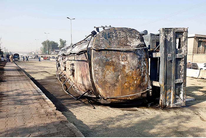A view of a burnt oil tanker which overturned at the Airport Road on late Wednesday night