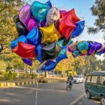 A vendor displaying different kinds of balloons at F-6 in the Federal Capital