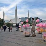 Vendors displaying sweet and salty stuff to attract customers at Faisal Masjid