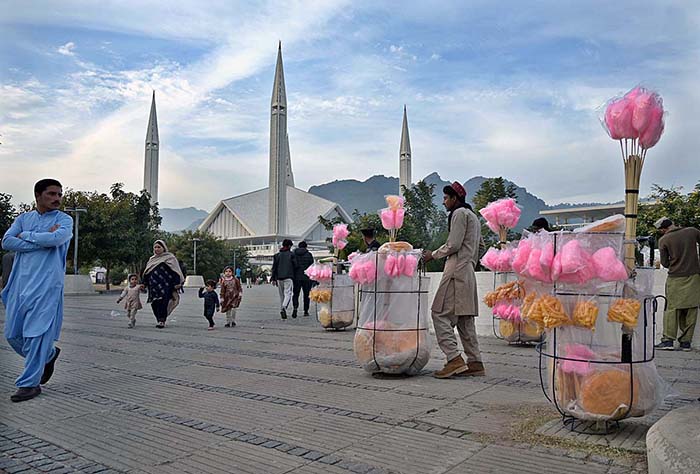 Vendors displaying sweet and salty stuff to attract customers at Faisal Masjid