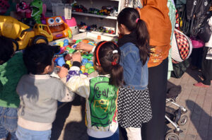 People purchasing household woolen stuff at G 9 weekly Bazaar in the Federal Capital.