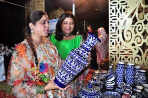 Visitors taking keen interest in displaying stuff at stall during Lok Mela organized by Parks and Horticulture Authority