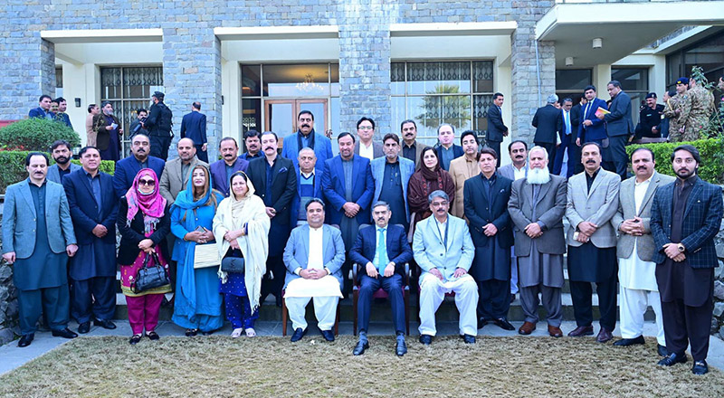 Caretaker Prime Minister in group photo with the Prime Minister and Cabinet members of Azad Jammu and Kashmir.