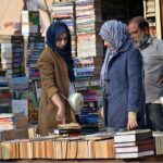 People busy in selecting and purchasing old books from roadside setup in Provincial Capital