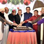 President Dr. Arif Alvi cutting a cake at the Christmas Celebration Ceremony 2023 at Aiwan-e-Sadr.