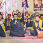 Singers performing Qawali on stage during Sufi night at Mehran Art Council.