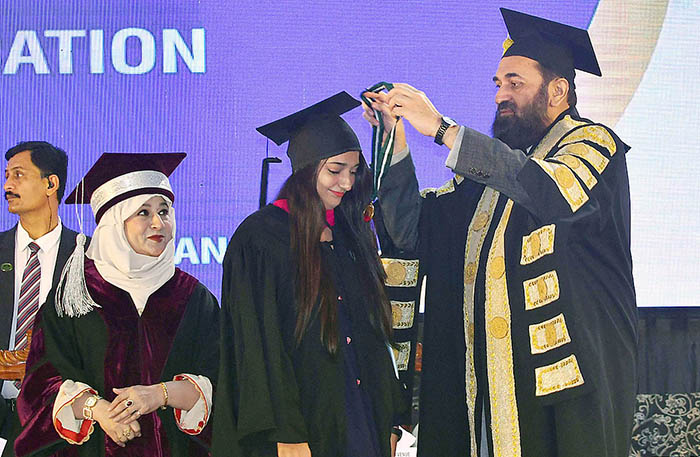 Governor Punjab Muhammad Baligh ur Rehman awarding gold medal among the position holder students during 6th Convocation of Women University Mattital Campus