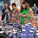 Visitors taking keen interest in displaying stuff at stall during Lok Mela organized by Parks and Horticulture Authority