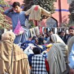 People selecting and purchasing used warm clothes at Landa Bazar as demand increase during winter season in the Provincial Capital