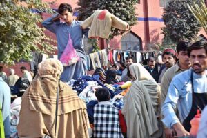 People selecting and purchasing used warm clothes at Landa Bazar as demand increase during winter season in the Provincial Capital