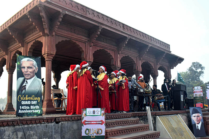 Students are performing a tableau on the stage during a program in connection with Christmas at Shalimar Garden