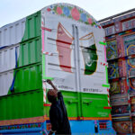A painter giving final touches to the truck at Carriage Factory