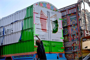 A painter giving final touches to the truck at Carriage Factory