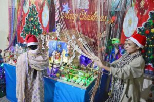 Christian girls busy decorating church in connection with upcoming Christmas