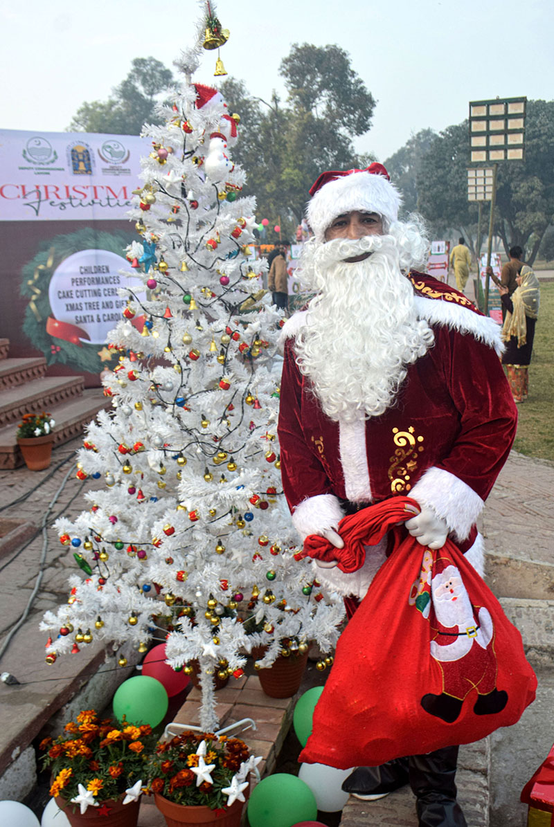 A student wearing a Santa Claus get-up during a program in connection with Christmas at Shalimar Garden