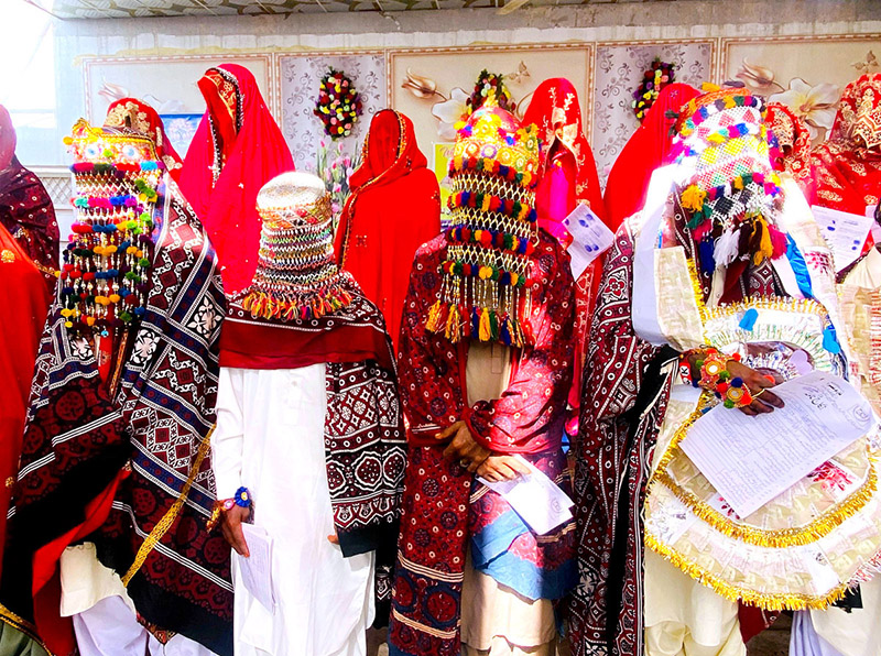 Grooms and brides during a mass marriage ceremony held in a local garden, organized by the Odero Lal Welfare Association. A total of 250 couples participated, including 125 Muslims and 125 Non-Muslims