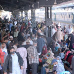 Passengers of the Pakistan Express wait for train at Cantt station platform, Train traffic is affected due to fog in the country