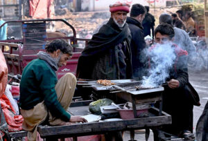 A roadside vendor selling barbeque at Fruit Market