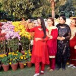 women takes a selfie in a flower show at Jilani Park Race Course