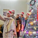 Christian girls busy decorating church in connection with upcoming Christmas