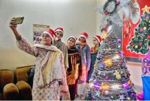 Christian girls busy decorating church in connection with upcoming Christmas