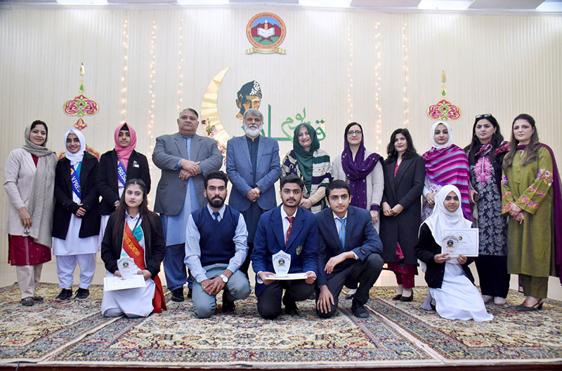 Prize winners of Quaid Day Declamation Contest organized by Federal Directorate of Education at Model College for Girls F-7/2 pose for group photo with Director General (FDE) Tanveer Ahmad and Principal Prof. Fouzia Sheikh