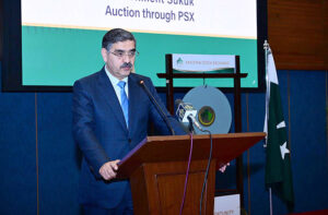 Caretaker Prime Minister Anwaar-ul-Haq Kakar addressing the Ceremony to mark the launch of Government Sukook Auction at Pakistan Stock Exchange