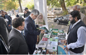 Caretaker Federal Minister for Information and Broadcasting Murtaza Solangi visiting the photo exhibition during the speech competition on Quaid Day organized by DEMP at Information Service Academy.