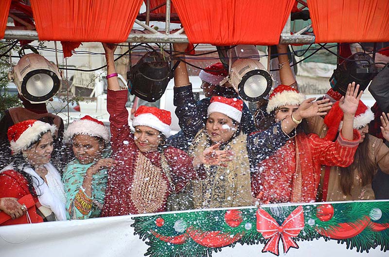 The female participants of a ‘Christmas Aman Rally’ waving their hands