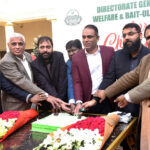 Directorate General Social Welfare Mudassar Riaz Malik is cutting the Christmas cake during the Christmas function at Social Welfare office